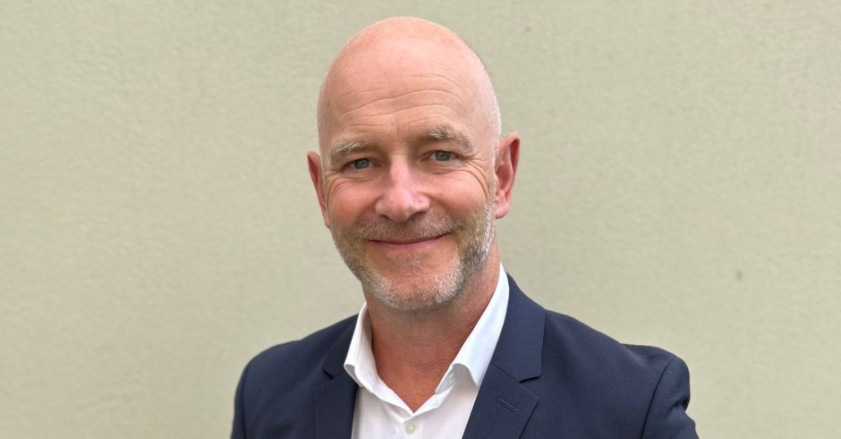 Gregor Zowierucha, CEO of PLATH GmbH & Co. KG, smiles into the camera. He is wearing a dark suit with a white shirt. The background is an office.